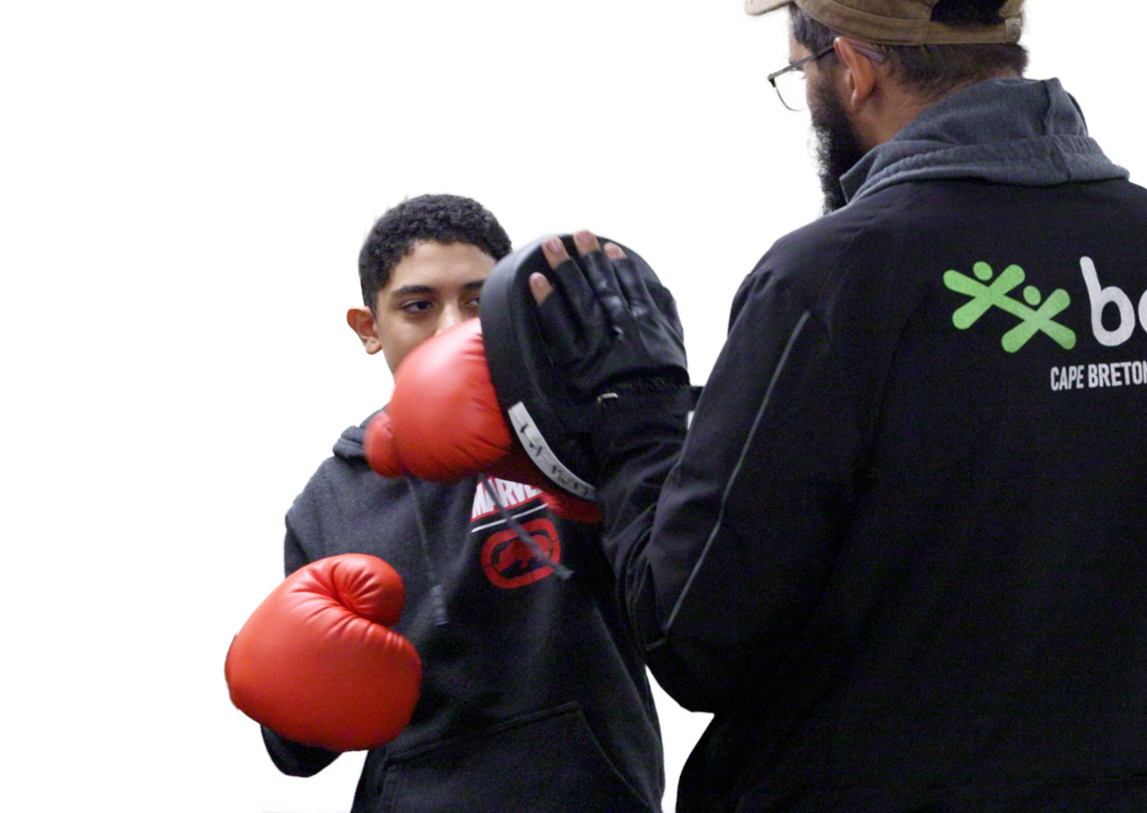Photo of BGCCB staff and youth practicing boxing.