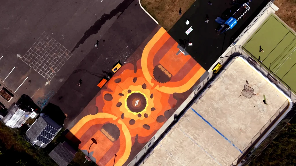 Overhead shot of the basketball court, hockey rink, and other outdoor spaces at BGCCB.